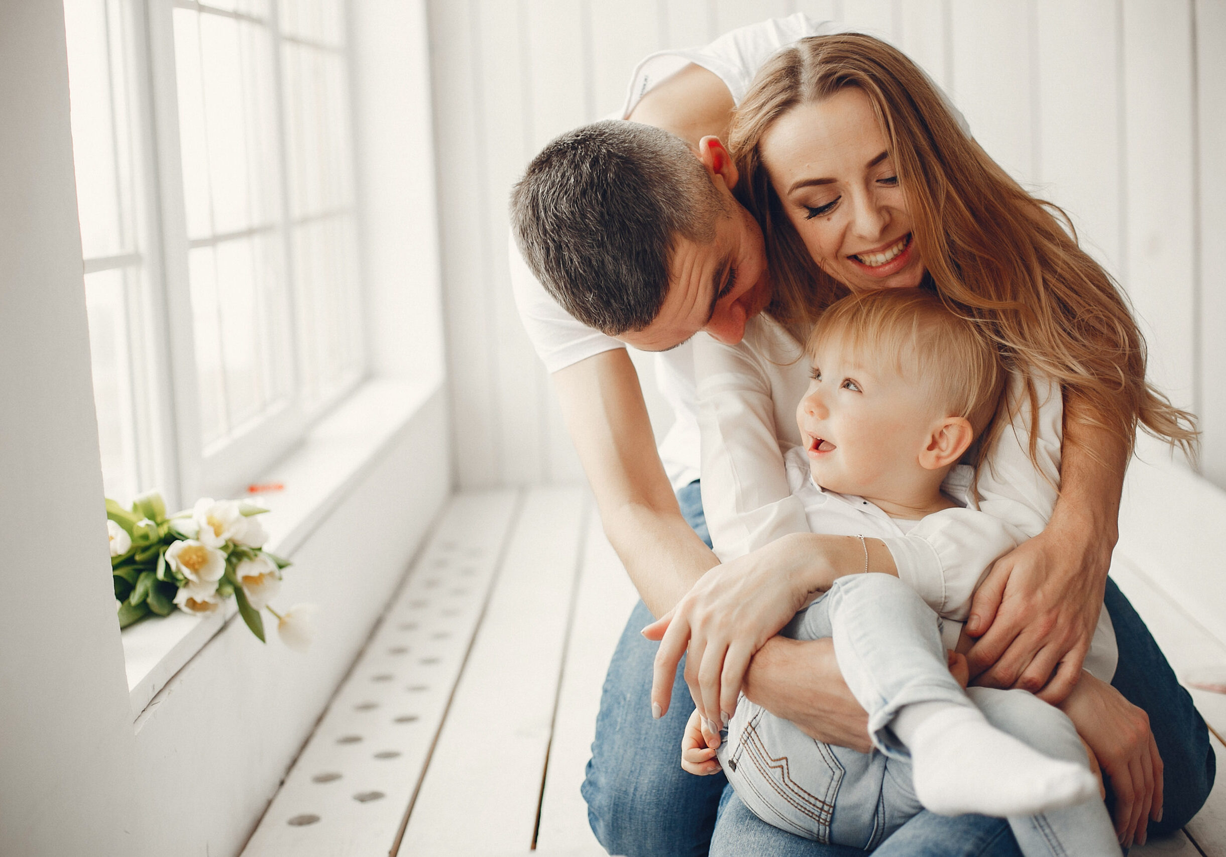 Family at home. Little girl with her brother. Mother and father with children