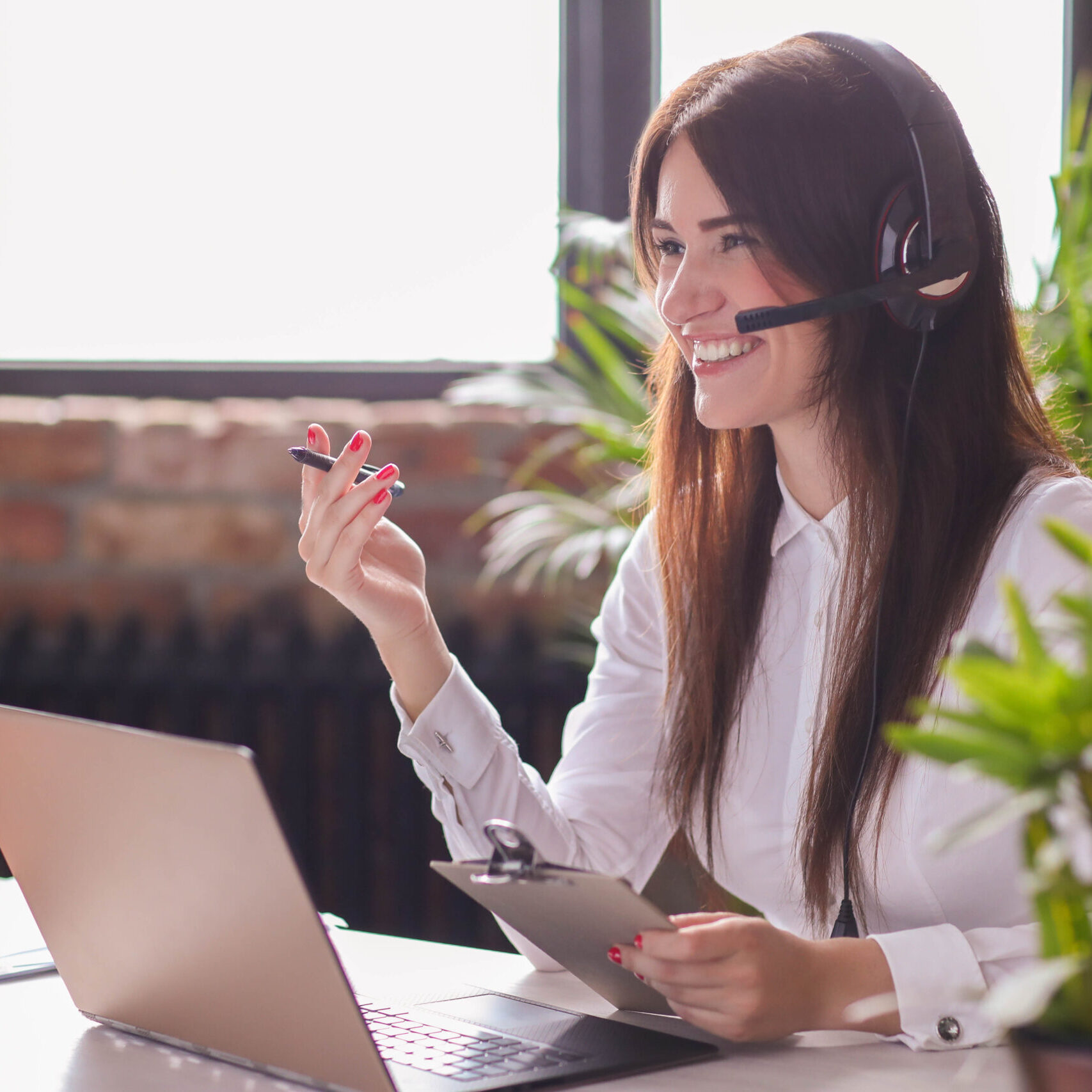 Woman working in call center as dispatcher